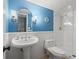 Updated bathroom with pedestal sink, toilet, and shower at 2900 Gulf Blvd # 212, Belleair Beach, FL 33786