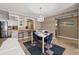 Dining area with white table and four blue chairs at 2900 Gulf Blvd # 212, Belleair Beach, FL 33786