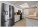 White kitchen cabinets, stainless steel appliances at 2900 Gulf Blvd # 212, Belleair Beach, FL 33786
