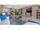 Bright living room with comfy seating, large TV, and open floor plan at 2900 Gulf Blvd # 212, Belleair Beach, FL 33786