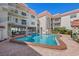 Refreshing kidney-shaped pool in a resort-style setting at 2900 Gulf Blvd # 212, Belleair Beach, FL 33786