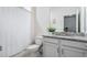 Clean bathroom with a shower/tub combo and granite vanity at 2919 Grand Kemerton Pl, Tampa, FL 33618