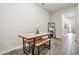 Small dining area with wooden table and bench seating at 2919 Grand Kemerton Pl, Tampa, FL 33618