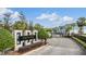 Gated community entrance to Kenerton Place with landscaping and signage at 2919 Grand Kemerton Pl, Tampa, FL 33618