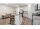 Modern kitchen with island, stainless steel appliances, and granite countertops at 2919 Grand Kemerton Pl, Tampa, FL 33618