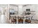 Modern kitchen with white cabinets, granite countertops, and stainless steel appliances at 2919 Grand Kemerton Pl, Tampa, FL 33618