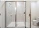 Large walk-in shower with glass doors and neutral tile at 2919 Grand Kemerton Pl, Tampa, FL 33618