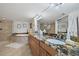 Elegant bathroom featuring a large soaking tub and double vanity at 3400 Gulf Blvd # 105, Belleair Beach, FL 33786