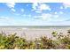 Beautiful beach with lush vegetation and ocean views at 3400 Gulf Blvd # 105, Belleair Beach, FL 33786