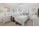 Guest bedroom with a queen-size bed and comfortable seating at 3400 Gulf Blvd # 105, Belleair Beach, FL 33786
