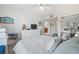 Bright bedroom with a queen bed and views of the ocean at 3400 Gulf Blvd # 105, Belleair Beach, FL 33786