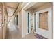 Exterior condo entryway with a tiled floor and access to the unit at 3400 Gulf Blvd # 105, Belleair Beach, FL 33786