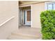 Condo entryway with door and small porch at 3400 Gulf Blvd # 105, Belleair Beach, FL 33786