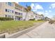 Beachfront building with lush landscaping and ocean views at 3400 Gulf Blvd # 105, Belleair Beach, FL 33786