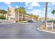Condo building with parking and signage, sunny day at 3400 Gulf Blvd # 105, Belleair Beach, FL 33786