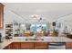 Kitchen with granite counters, island, and ocean view at 3400 Gulf Blvd # 105, Belleair Beach, FL 33786