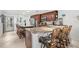 L-shaped kitchen with granite counters and breakfast bar at 3400 Gulf Blvd # 105, Belleair Beach, FL 33786
