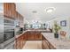 Granite countertop kitchen island and stainless steel appliances at 3400 Gulf Blvd # 105, Belleair Beach, FL 33786