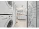 Convenient laundry room with stackable washer and dryer at 3400 Gulf Blvd # 105, Belleair Beach, FL 33786