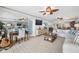 Living room features a sectional sofa, ocean view, and a convenient workspace at 3400 Gulf Blvd # 105, Belleair Beach, FL 33786