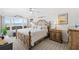 Relaxing main bedroom with ocean view and king-size bed at 3400 Gulf Blvd # 105, Belleair Beach, FL 33786