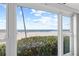 Lovely ocean view from bedroom window, showing beach and ocean at 3400 Gulf Blvd # 105, Belleair Beach, FL 33786