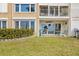 Private patio with ocean view, telescope, and seating at 3400 Gulf Blvd # 105, Belleair Beach, FL 33786