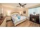 Spacious bedroom with a king-size bed and fireplace at 5025 Cactus Needle Ln, Wesley Chapel, FL 33544