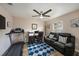 Home office features a workspace, seating area, and treadmill at 5025 Cactus Needle Ln, Wesley Chapel, FL 33544