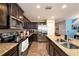 Modern kitchen with granite countertops and stainless steel appliances at 5025 Cactus Needle Ln, Wesley Chapel, FL 33544