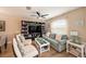 Bright living room featuring comfortable seating and built-in shelving at 5025 Cactus Needle Ln, Wesley Chapel, FL 33544