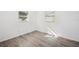 Bedroom with wood-look floors and neutral walls at 5430 Palm Crest N Ct, Pinellas Park, FL 33782