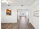 Dining area with wood-look floors and kitchen pass-through at 5430 Palm Crest N Ct, Pinellas Park, FL 33782