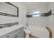 Clean bathroom, featuring a shower/tub combo and gray vanity at 6609 N Elizabeth St, Tampa, FL 33604