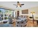 Bright living room with comfy seating and large windows at 700 Bowsprit Pl, Palm Harbor, FL 34685