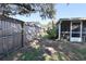 Side yard with wooden fence at 7838 Avenal Loop, New Port Richey, FL 34655
