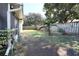 Simple backyard with grass and fence at 7838 Avenal Loop, New Port Richey, FL 34655