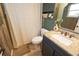 Bathroom with granite vanity and shower/tub combo at 7838 Avenal Loop, New Port Richey, FL 34655