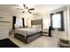 Main bedroom with a plush bed and stylish decor at 7838 Avenal Loop, New Port Richey, FL 34655