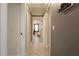 Clean and bright hallway with tile flooring at 7838 Avenal Loop, New Port Richey, FL 34655