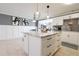 Modern kitchen with a large island and stainless steel appliances at 7838 Avenal Loop, New Port Richey, FL 34655