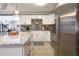 Sleek kitchen with stainless steel appliances and marble countertops at 7838 Avenal Loop, New Port Richey, FL 34655