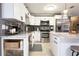 Updated kitchen boasts stainless steel appliances and white cabinetry at 7838 Avenal Loop, New Port Richey, FL 34655
