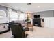 Bright and airy living room featuring a modern fireplace at 7838 Avenal Loop, New Port Richey, FL 34655