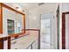 Bathroom with pink tile and a vanity at 2901 Dr Martin Luther King Jr S St, St Petersburg, FL 33705