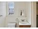 Small bathroom with toilet and sink at 2901 Dr Martin Luther King Jr S St, St Petersburg, FL 33705