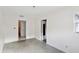 Bedroom with carpet, access to bathroom, and window at 2901 Dr Martin Luther King Jr S St, St Petersburg, FL 33705