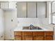 Small kitchen with gray cabinets and double sink at 2901 Dr Martin Luther King Jr S St, St Petersburg, FL 33705