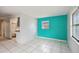 Living room with teal accent wall and tiled floor at 2901 Dr Martin Luther King Jr S St, St Petersburg, FL 33705