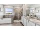 Double vanity bathroom with a large shower and soaking tub at 1011 159Th E Way, Bradenton, FL 34212